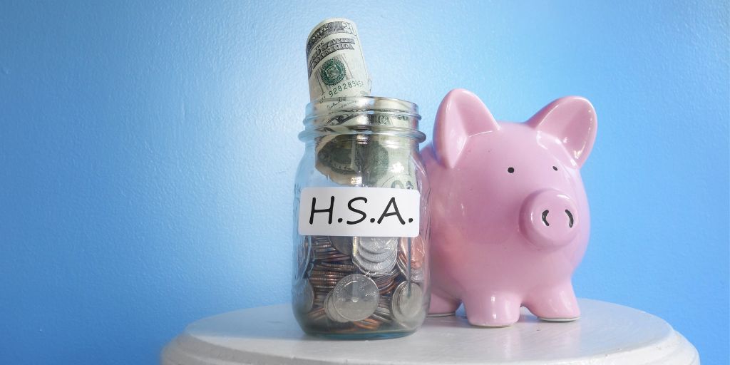 HSA jar filled with coins and piggy bank